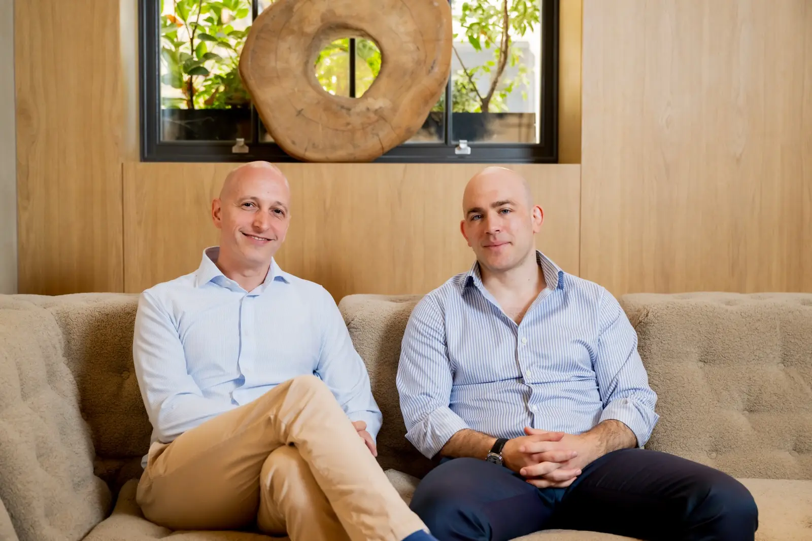 Arik and Moshe, the founders of Steward, sitting together on a couch